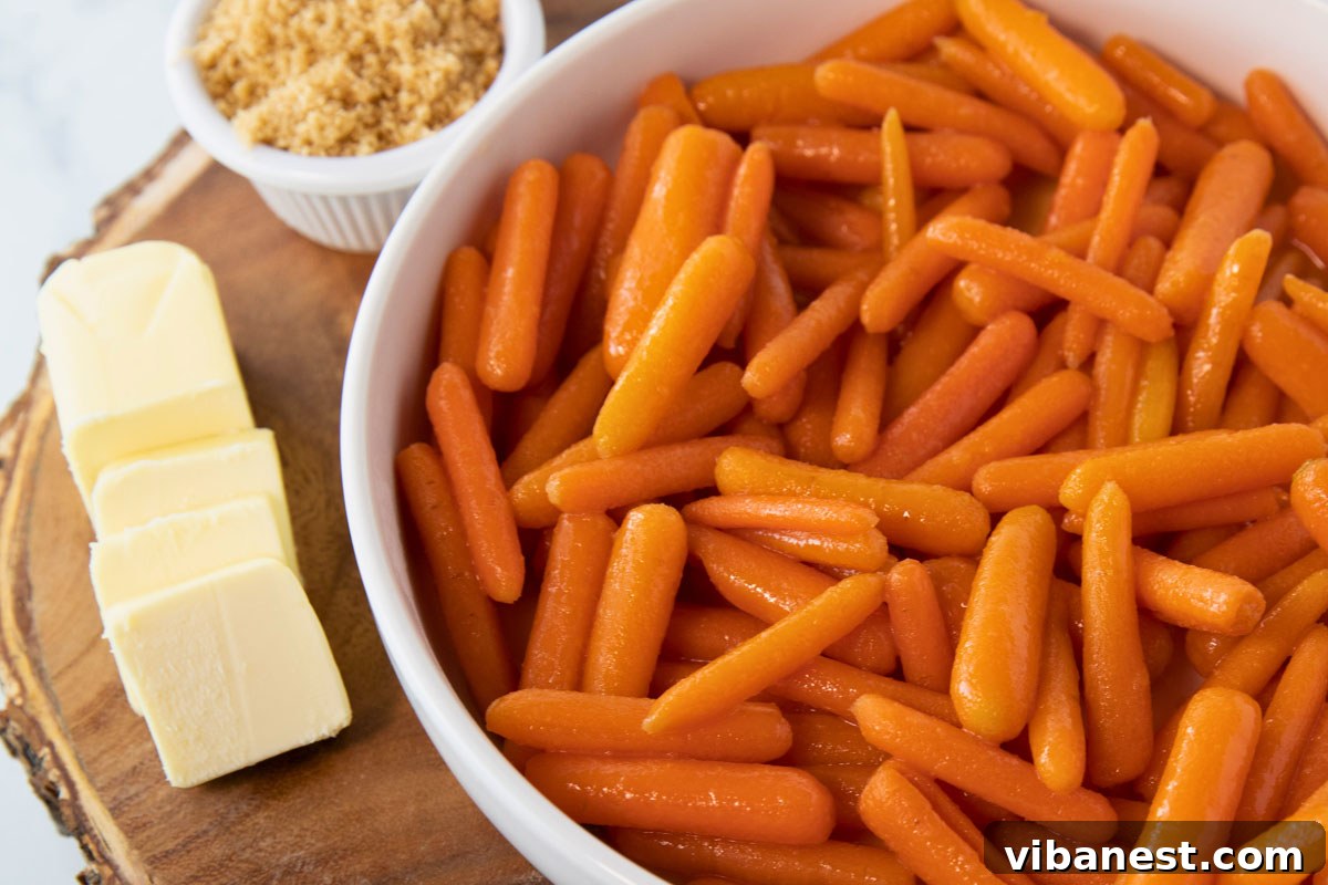 Glistening Brown Sugar Baby Carrots 4 A bowl of cooked carrots next to a bowl of butter and brown sugar, illustrating the glaze ingredients.