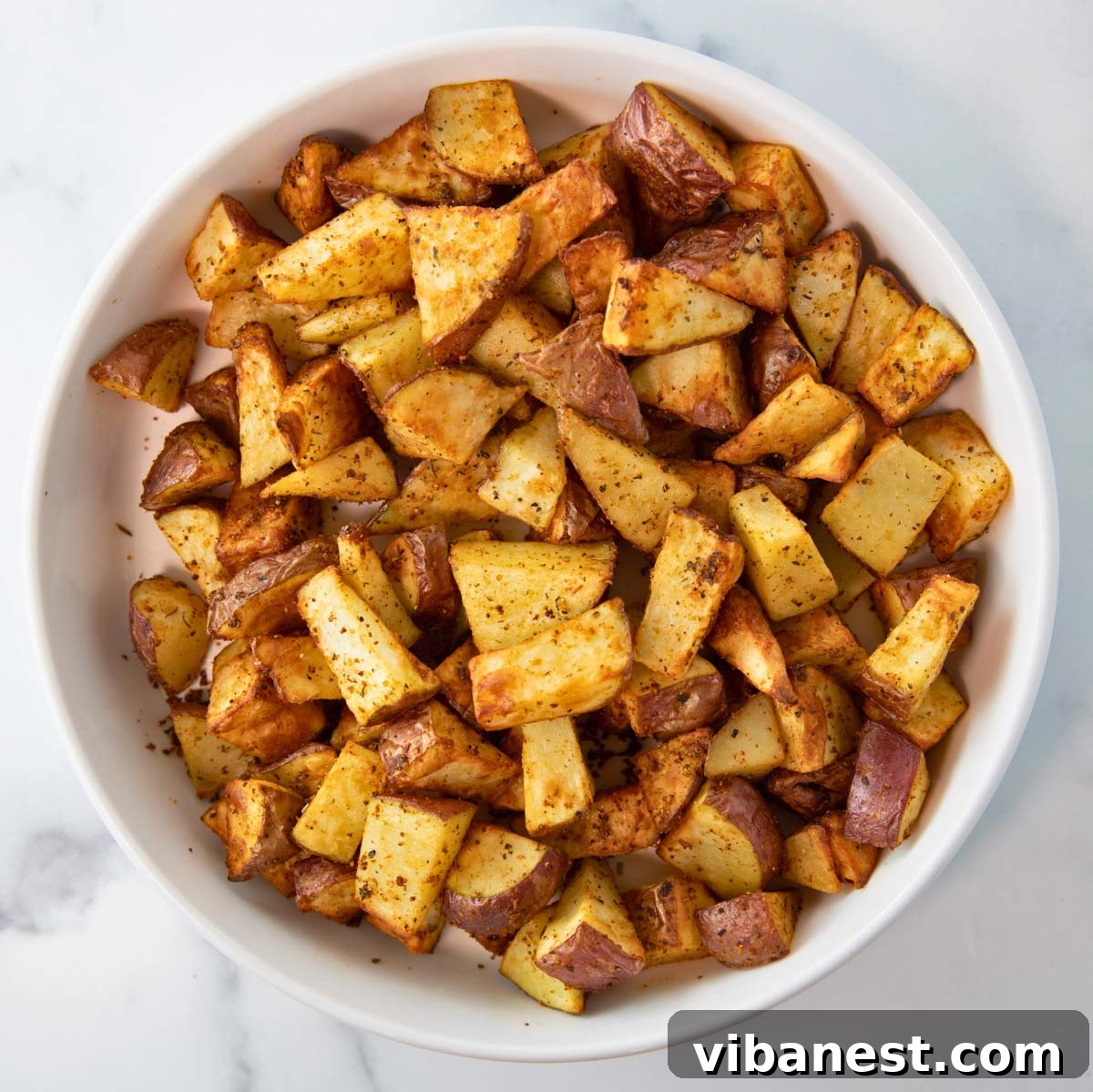 Crispy Air Fryer Red Potatoes 5 Close-up overhead shot of a generous bowl of freshly air-fried red potatoes, perfectly seasoned and ready to be enjoyed.