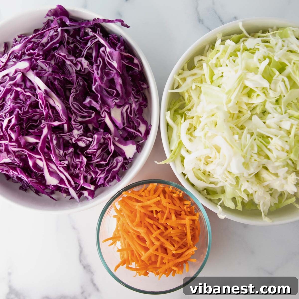 Bright Apple Cider Vinegar Slaw 5 Carrots being shredded for the coleslaw.