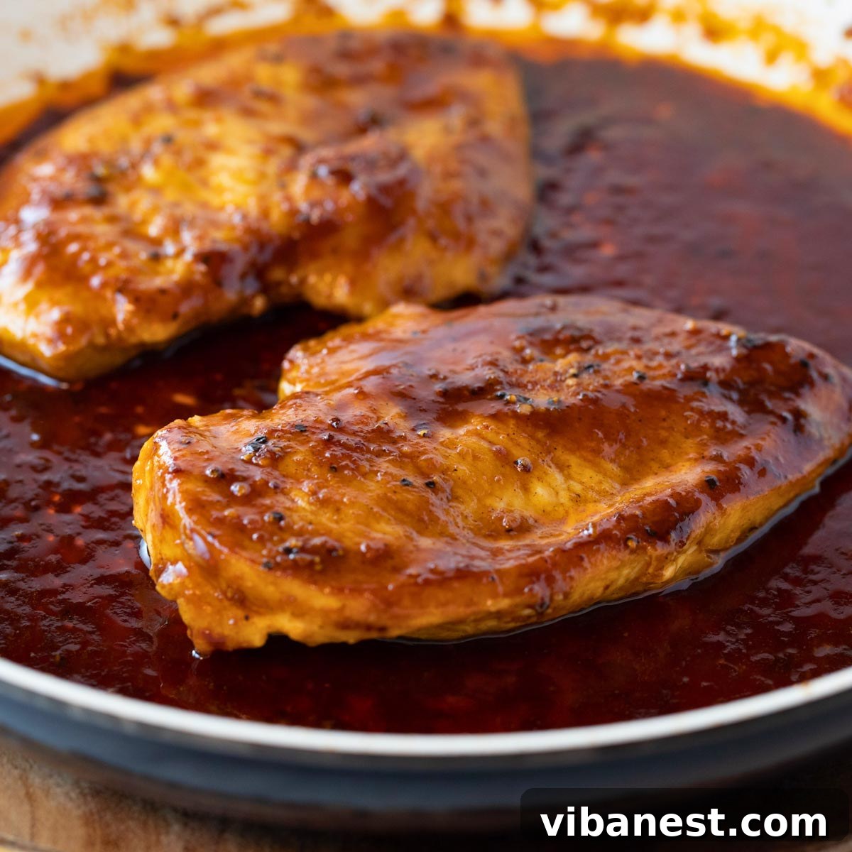 Sizzling Stovetop BBQ Chicken 4 Close-up of skillet BBQ chicken, showing the rich, glossy sauce.