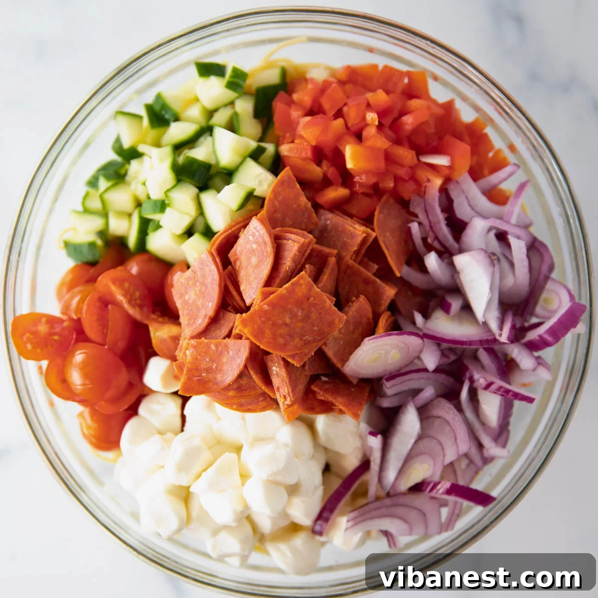 Effortless Zesty Spaghetti Salad 5 bowl of ingredients for spaghetti pasta salad