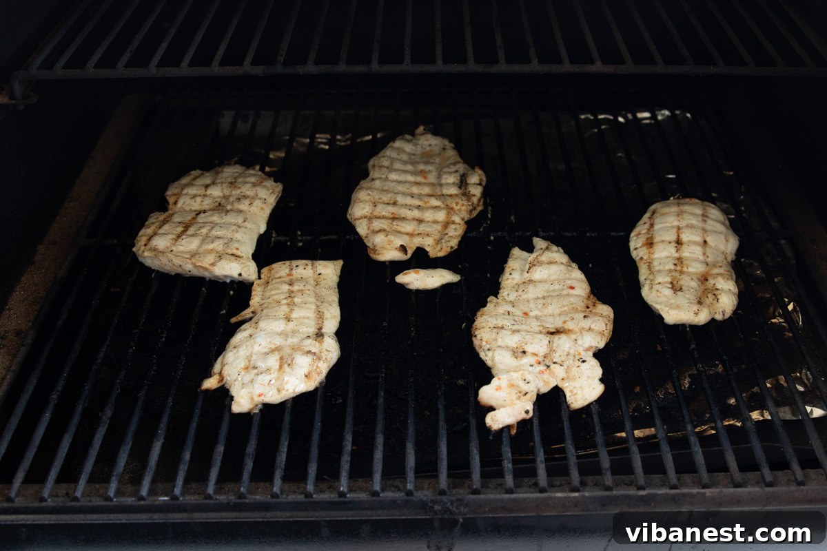 Effortlessly Delicious Thin Chicken Breasts 4 Perfectly grilled thin-sliced chicken breasts with savory char marks