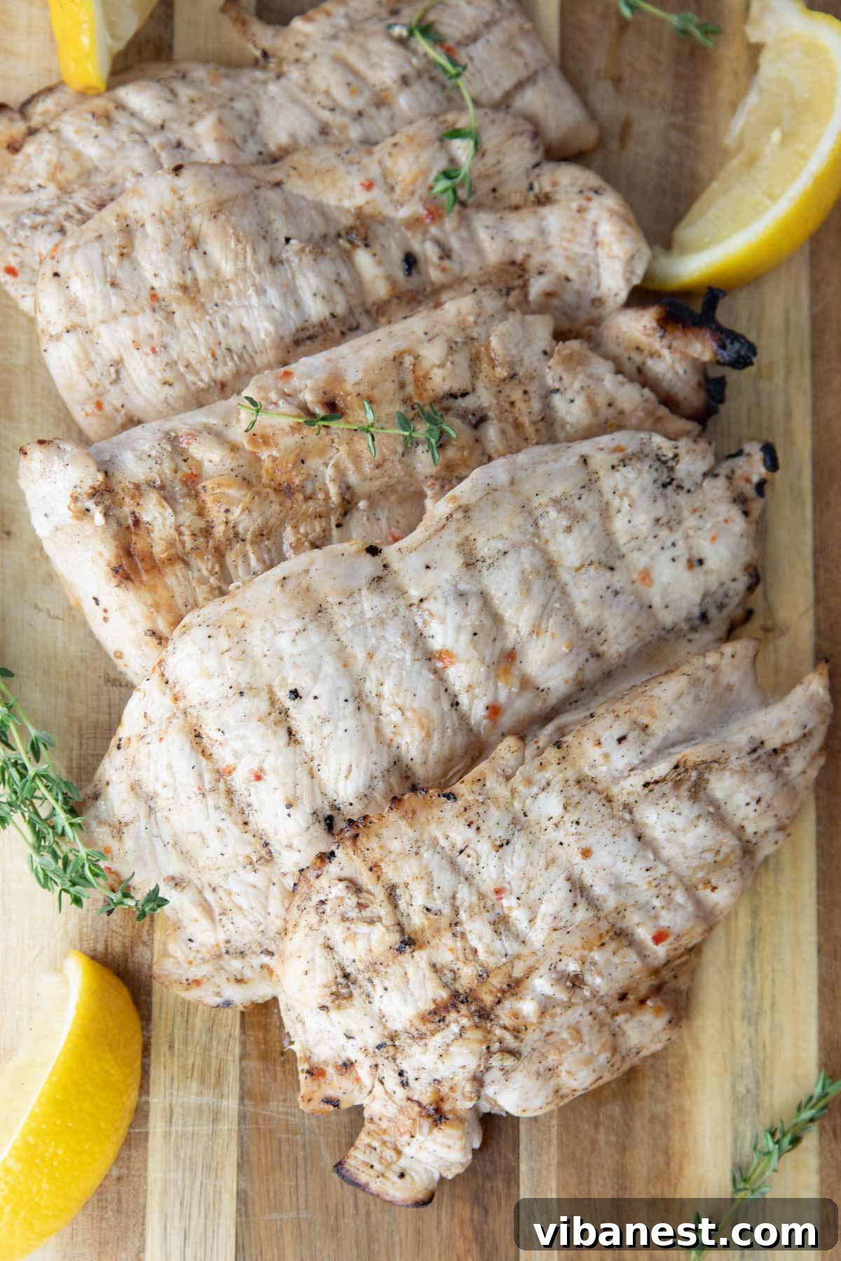 Effortlessly Delicious Thin Chicken Breasts 6 Collection of grilled thin-sliced chicken breasts on a platter, ready for a meal