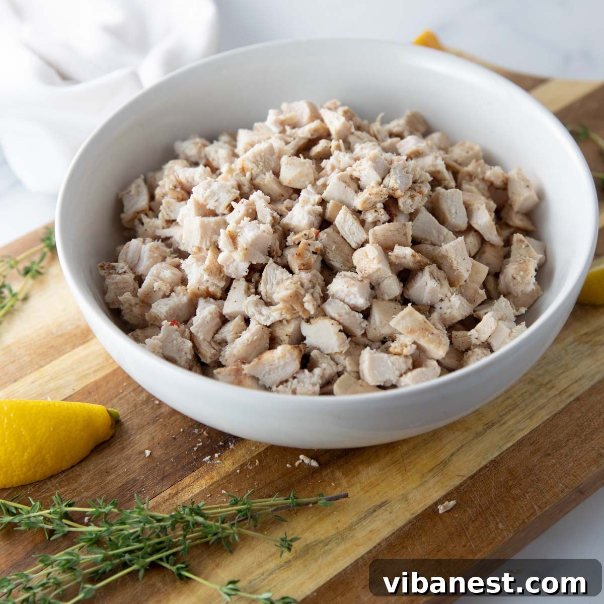 Effortlessly Delicious Thin Chicken Breasts 7 Assortment of thin-sliced grilled chicken breasts and fresh ingredients for meal prep