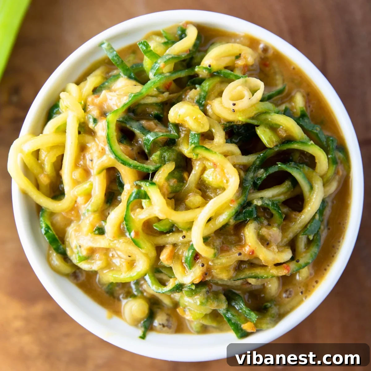 TikToks Viral Cucumber Salad Duet 10 Spiralized cucumber salad with an Asian-inspired dressing, showcasing its unique texture and vibrant colors.