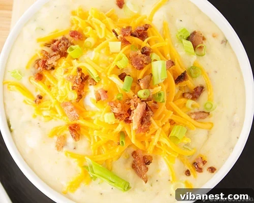 loaded baked potato soup 3.jpg A close-up of a bowl of creamy potato soup without chicken broth, highlighting its rich texture.