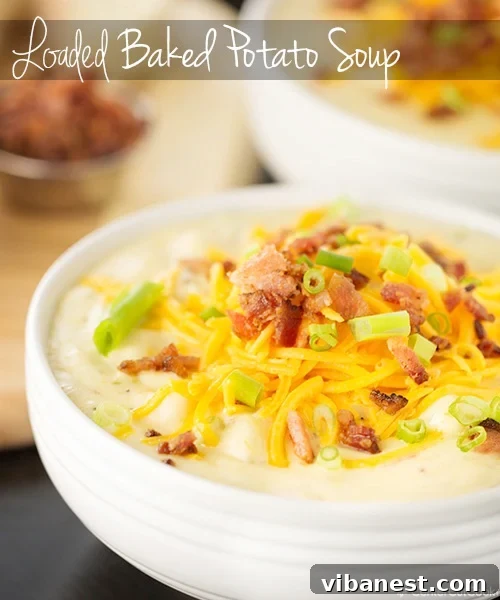 loaded baked potato soup 5.jpg A large pot of simmering loaded baked potato soup, creamy and rich.