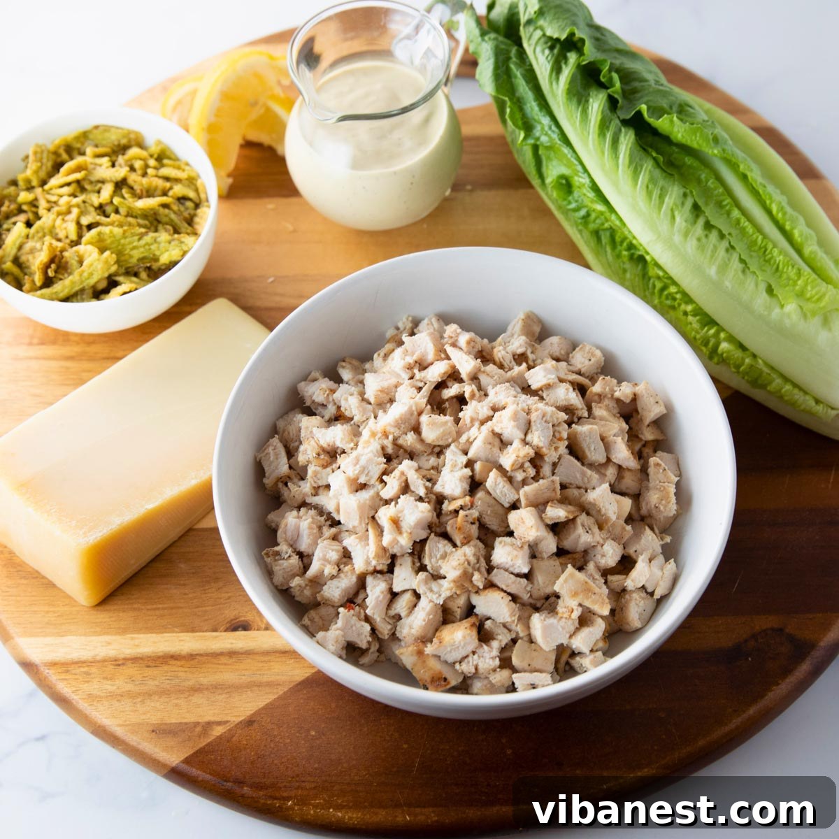 Next-Level Chicken Caesar Wraps 3 ingredients to make chicken caesar wraps - all components laid out