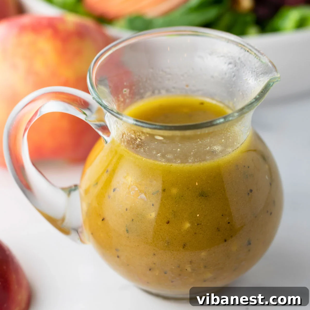 Crisp Apple Vinaigrette 2 A vibrant salad featuring a drizzle of homemade apple cider vinaigrette dressing, embodying the essence of fall.