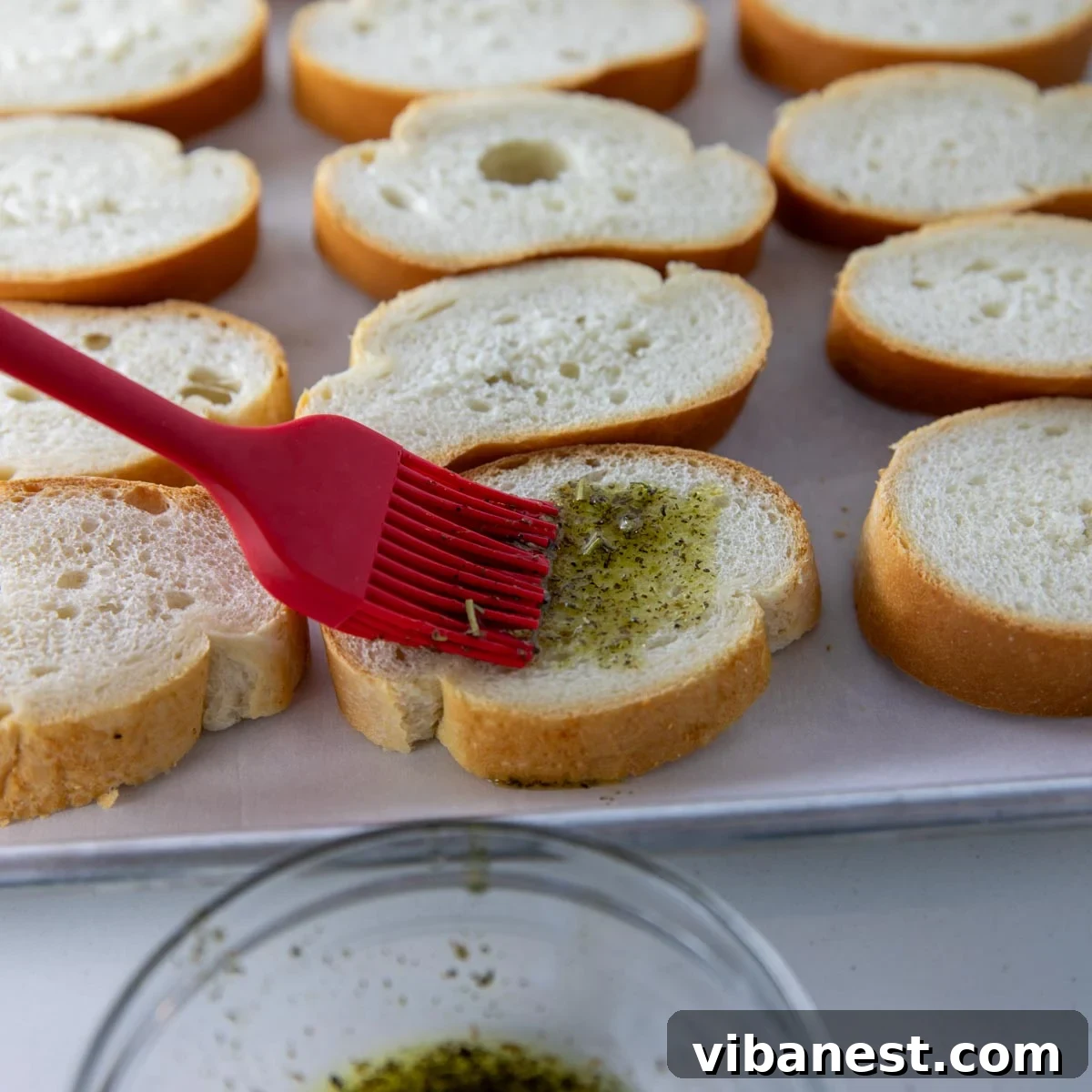 Melted Mozzarella Bruschetta 11 Brushing bread with olive oil