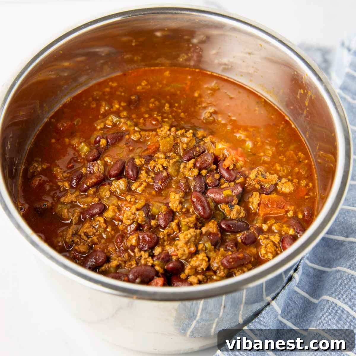 Ultimate Instant Pot Chili 5 Cooking chili in the Instant Pot, showing the ingredients after being added