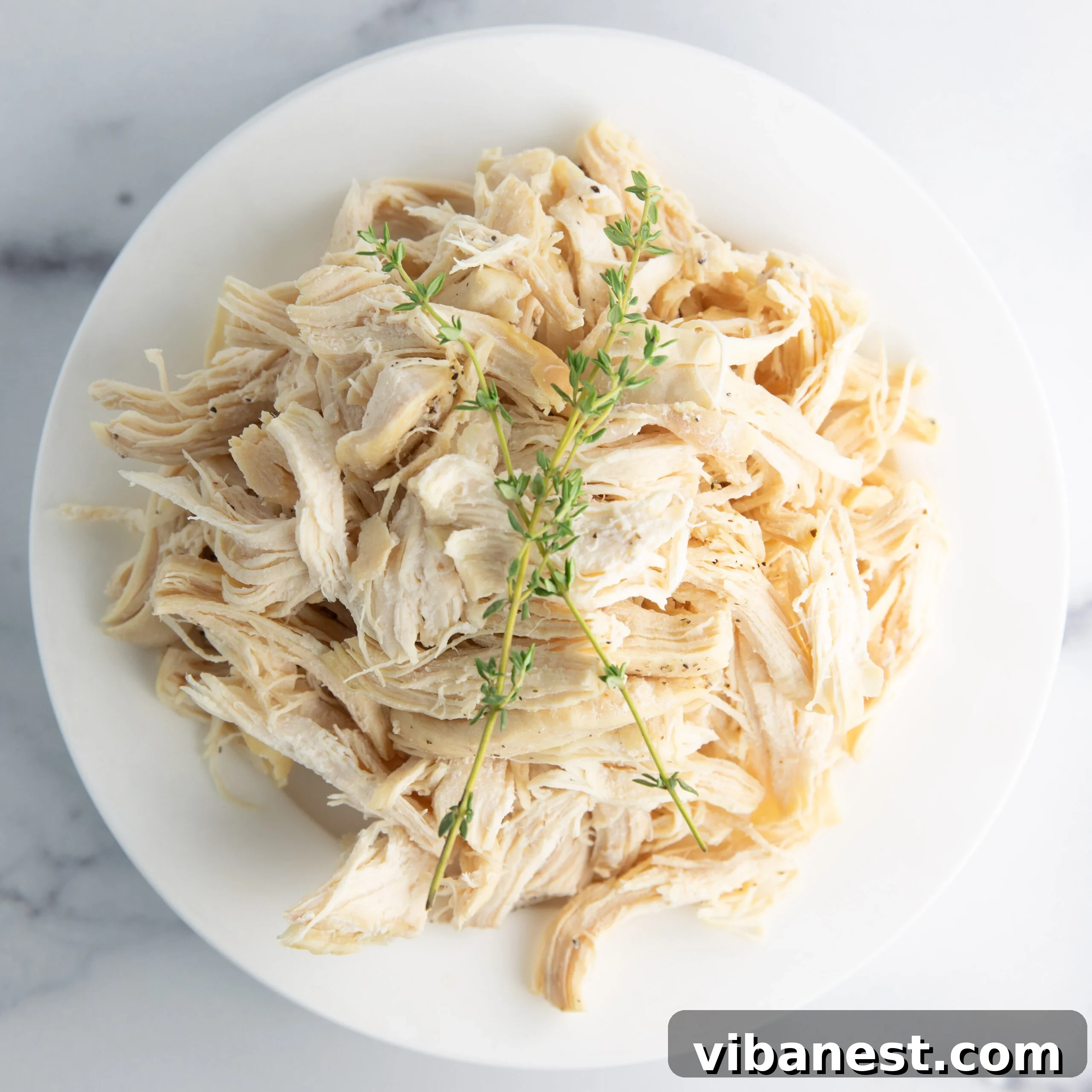 No Thaw, No Fuss Instant Pot Chicken Breasts 9 A serving platter filled with tender, juicy Instant Pot frozen chicken breasts, ready to be enjoyed.