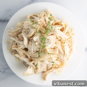 Perfectly cooked, shredded Instant Pot frozen chicken breasts, ready for use in a variety of recipes.