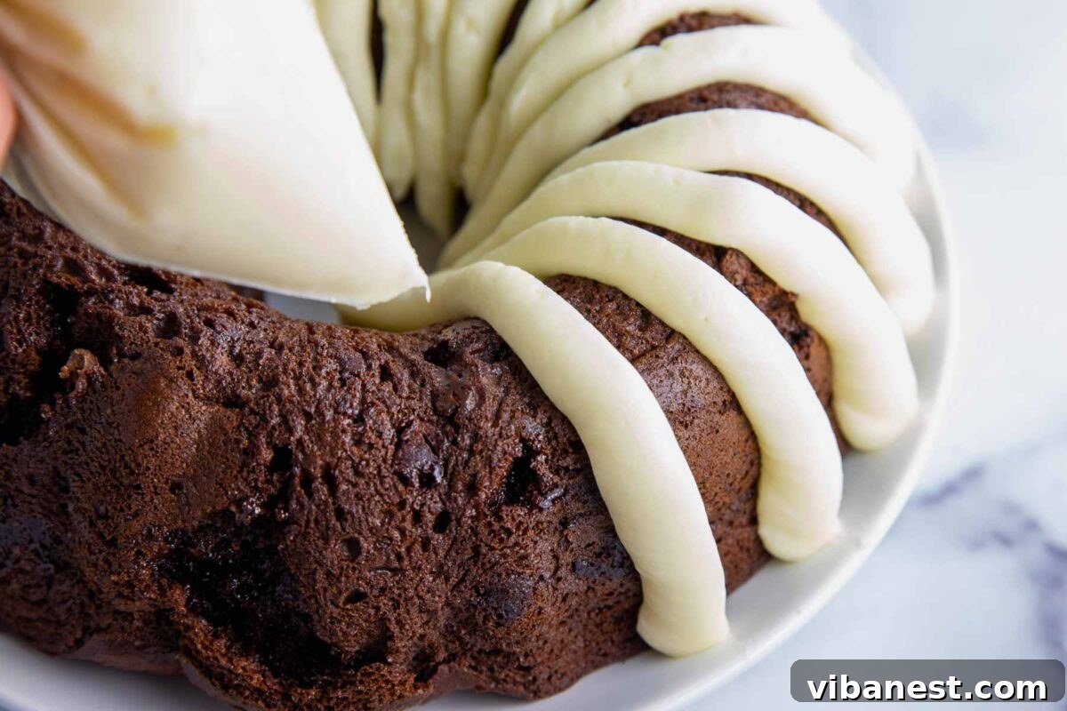 Irresistible Cream Cheese Frosting 4 Decadent cream cheese frosting artfully spread on a baked cake