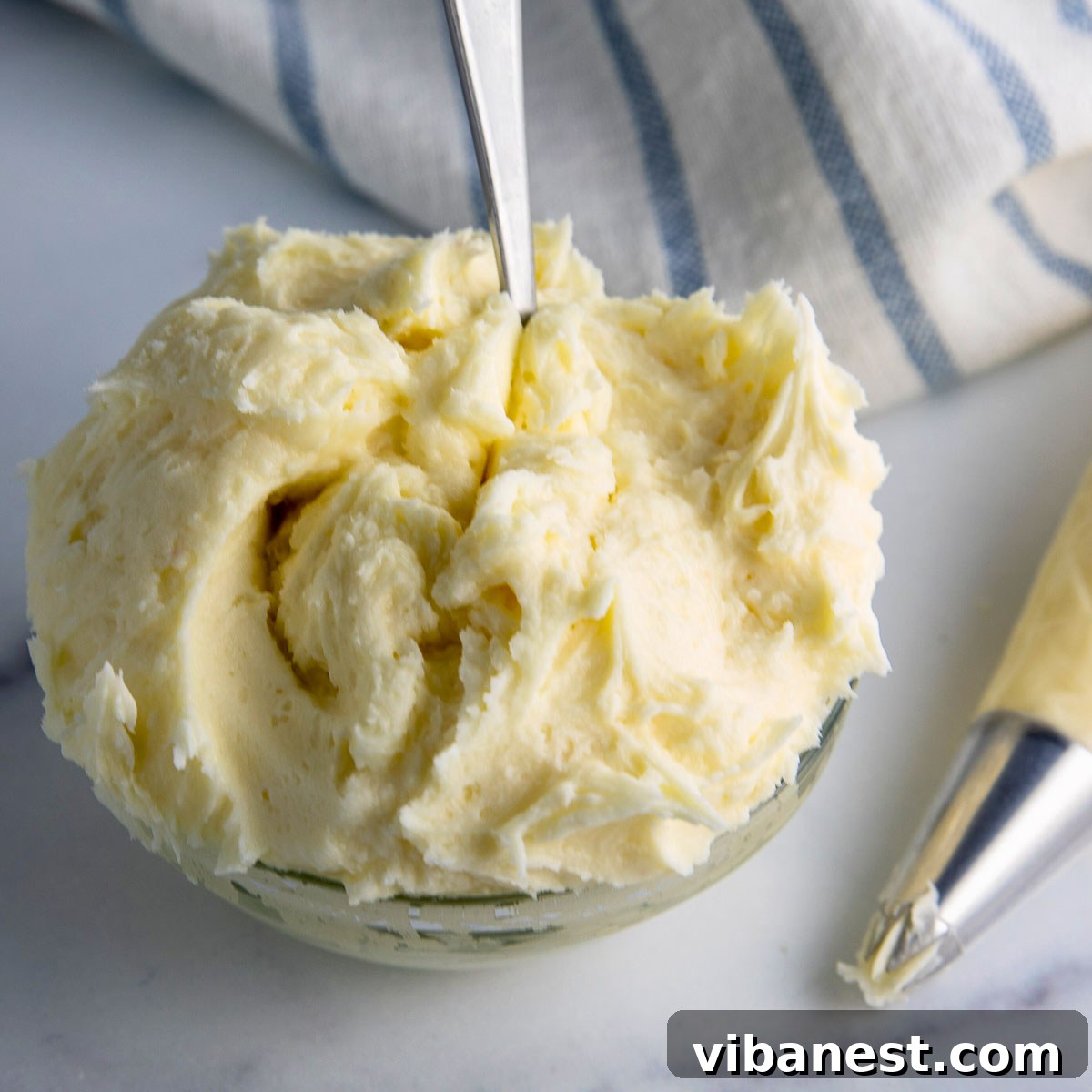 Irresistible Cream Cheese Frosting 8 A large bowl of decadent cream cheese frosting ready for cakes or cupcakes