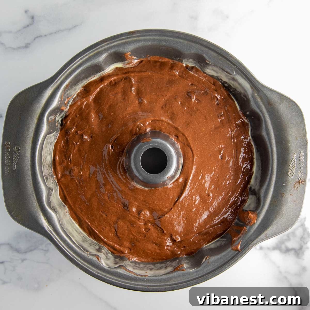 Decadent Double Chocolate Bundt Cake 11 Gooey milk chocolate chips gently folded into the luscious chocolate bundt cake batter before baking.