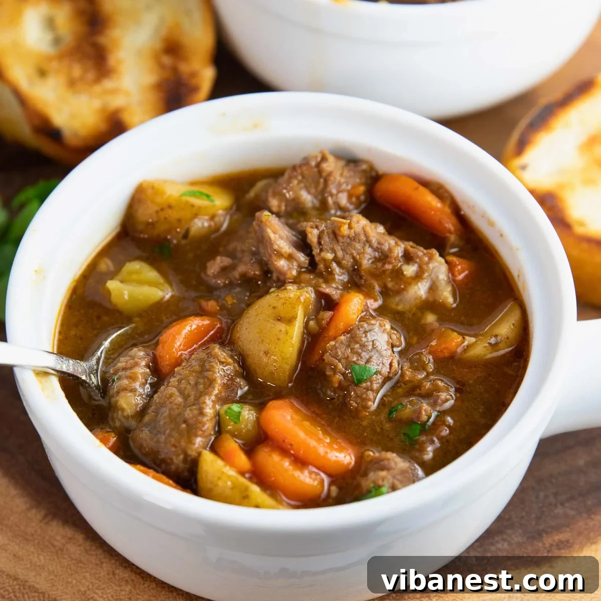 Instant Pot Irish Comfort Stew 2 Close-up of a spoonful of hearty Instant Pot Irish beef stew with tender beef and chunky vegetables.