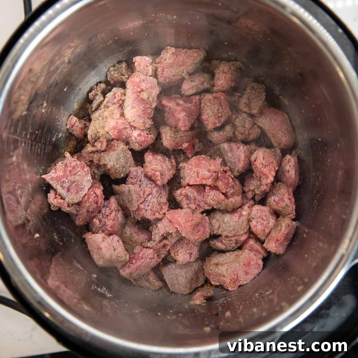 Instant Pot Irish Comfort Stew 6 Beef searing in the Instant Pot until perfectly browned on all sides.