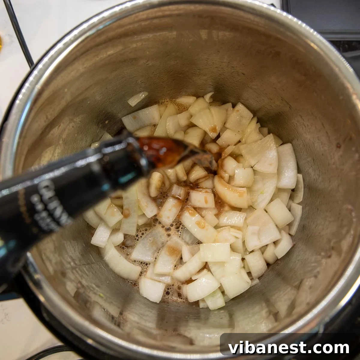 Instant Pot Irish Comfort Stew 9 Deglazing the Instant Pot with Guinness beer and scraping up all the flavorful browned bits.