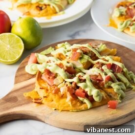 Delicious BLT flatbreads topped with creamy avocado spread, a perfect light meal.