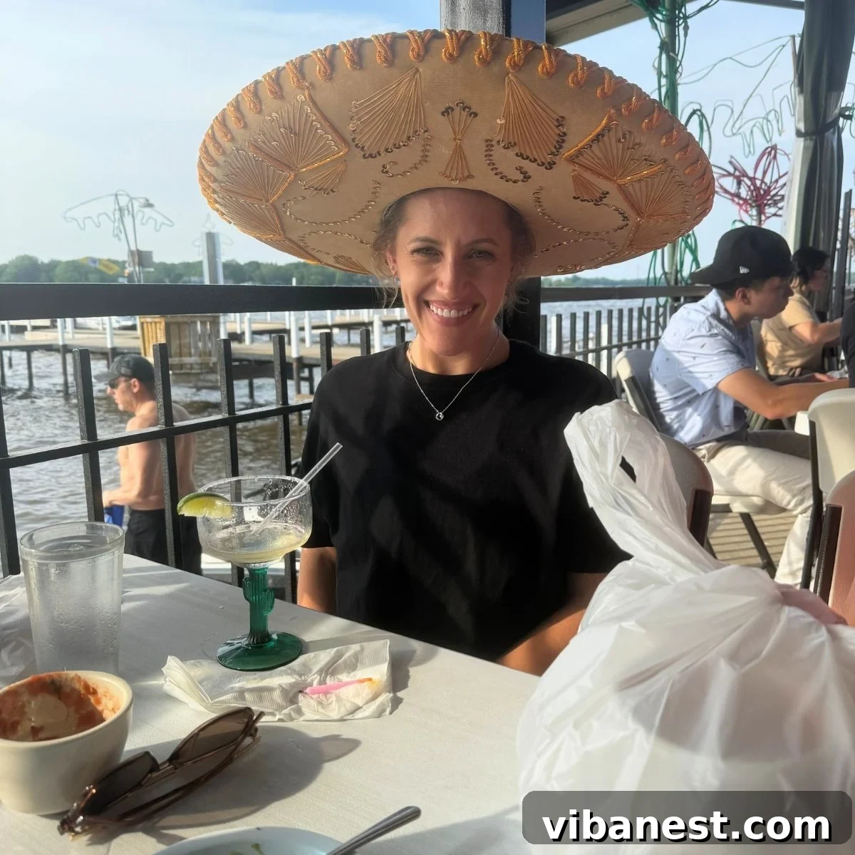 Friday Five: August 8, 2025 2 Smiling woman in a sombrero, celebrating her birthday with a margarita.