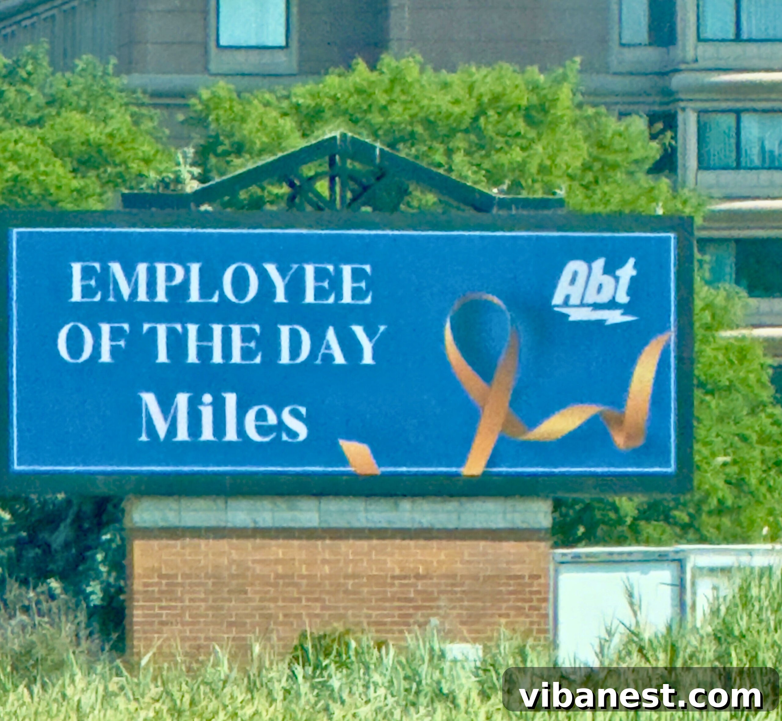 Friday Five September 5, 2025 2 Miles, a young boy, smiling broadly and looking at his name on a large digital sign at Abt Electronics during his wish day. He appears excited and happy.
