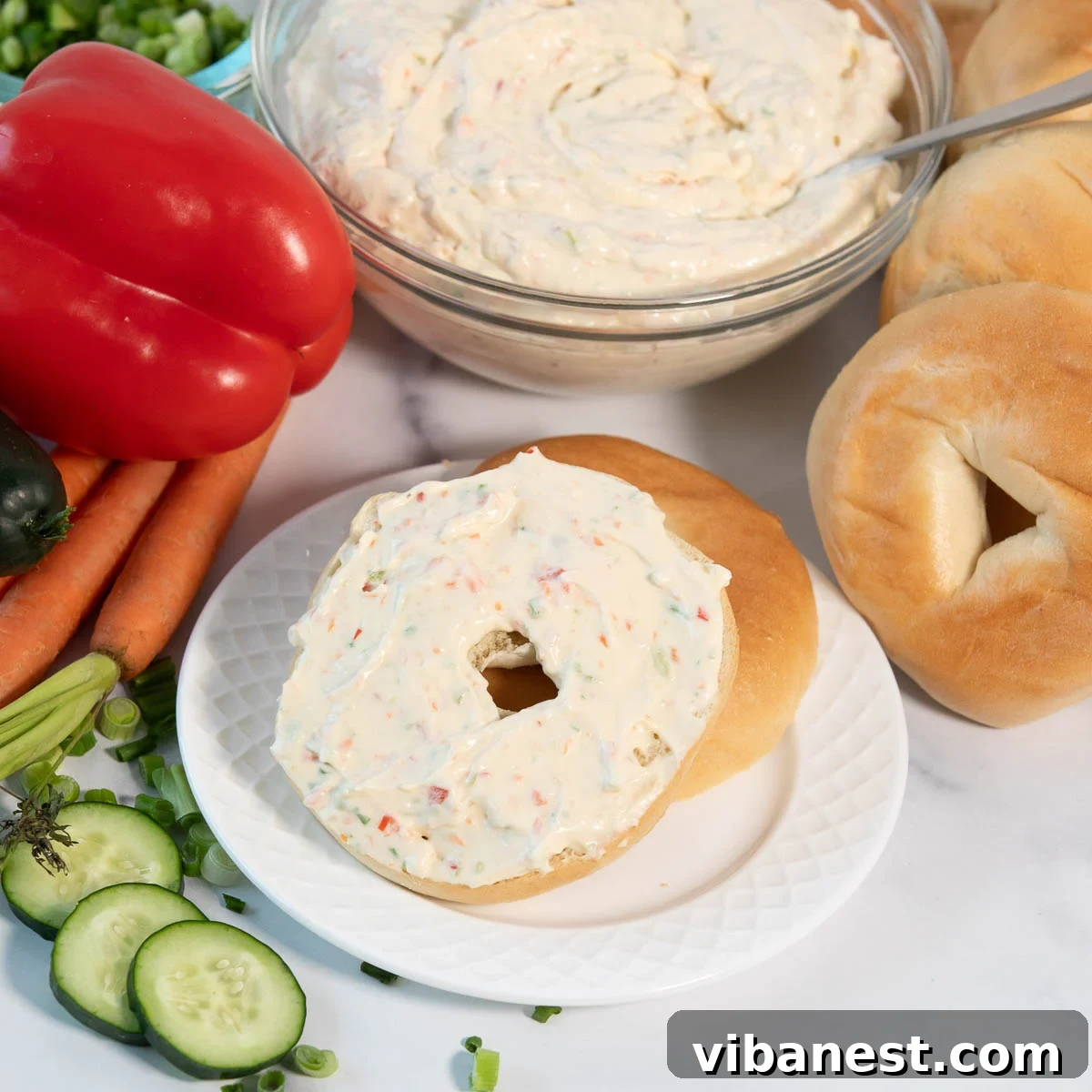 Garden Fresh Cream Cheese Veggie Spread 2 Fresh homemade garden vegetable cream cheese spread on a toasted bagel.
