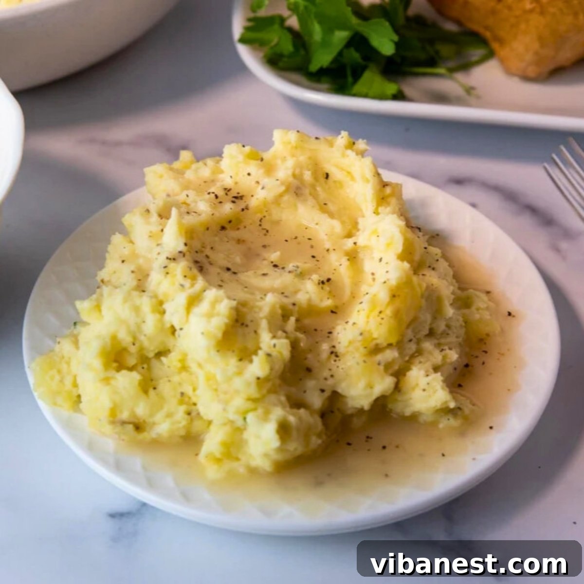Effortless Chicken Gravy Drippings Optional 5 whisking chicken gravy in a saucepan
