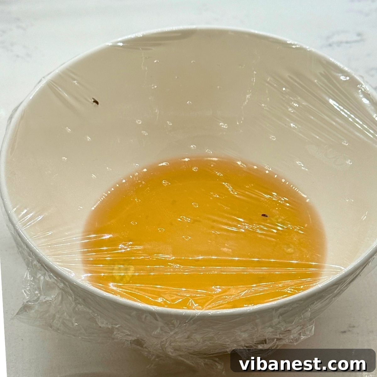 Friday Five: October 3, 2025 4 A simple homemade fruit fly trap using a glass jar, apple cider vinegar, and plastic wrap with small holes.
