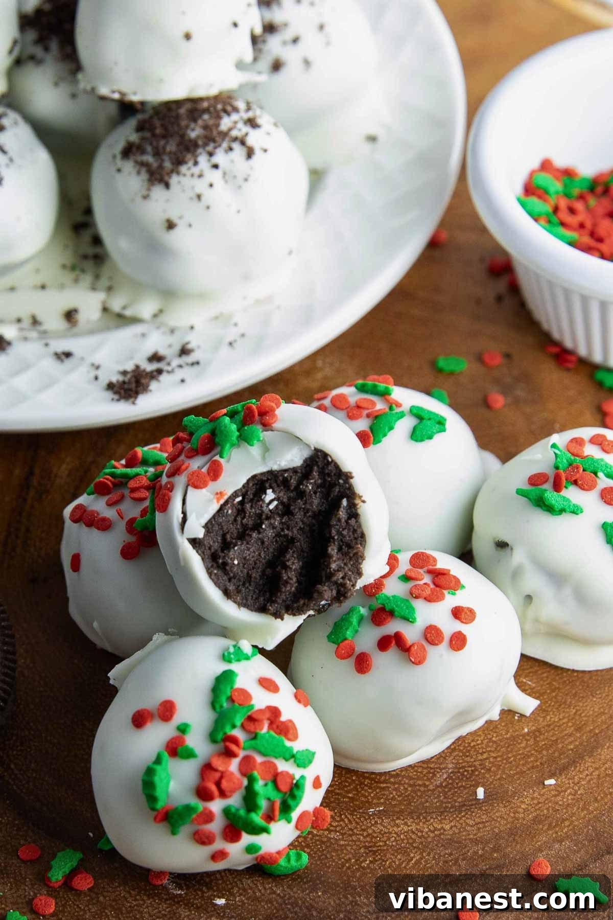 Effortless Holiday Oreo Delights 12 Close-up of beautifully decorated Oreo truffles, sparkling with a variety of colorful Christmas sprinkles, ready to be enjoyed.