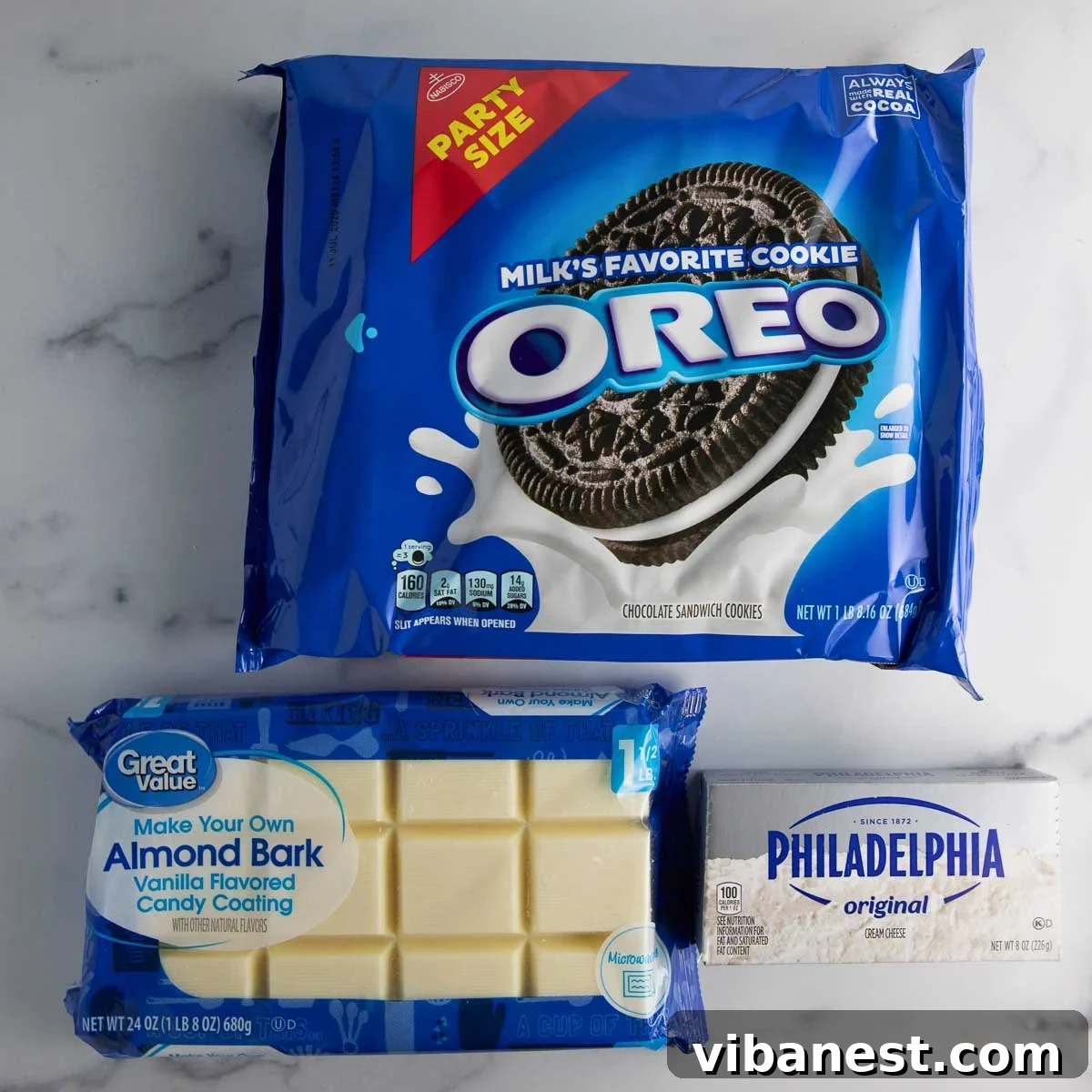 Effortless Holiday Oreo Delights 4 The simple trio of ingredients: Oreo cookies, cream cheese, and almond bark, ready to be transformed into festive treats.