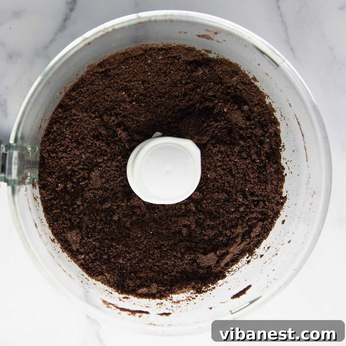 Effortless Holiday Oreo Delights 5 Finely crushed Oreo cookies in a food processor, perfectly prepped for combining with cream cheese to make delicious truffles.