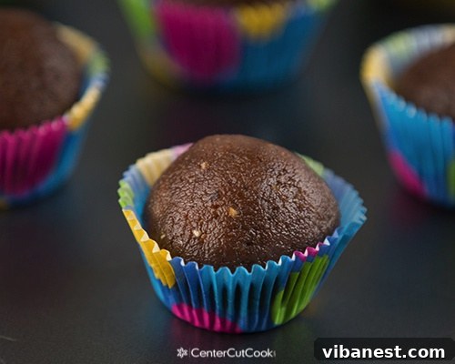 Hand rolling the chocolate peanut butter energy bite mixture into perfect spherical shapes.