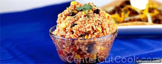 Delicious Taco Rice served in a vibrant bowl, garnished with fresh cilantro and a lime wedge.