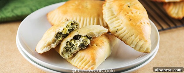 Creamy Artichoke Spinach Pockets - golden brown pastry filled with savory dip, perfect for a snack or meal