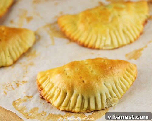 Close-up of a freshly baked Creamy Artichoke Spinach Pocket, showcasing its tender crust and creamy filling