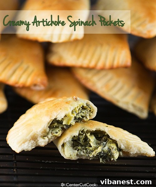 A serving plate filled with several golden-brown Creamy Artichoke Spinach Pockets, ready to be enjoyed
