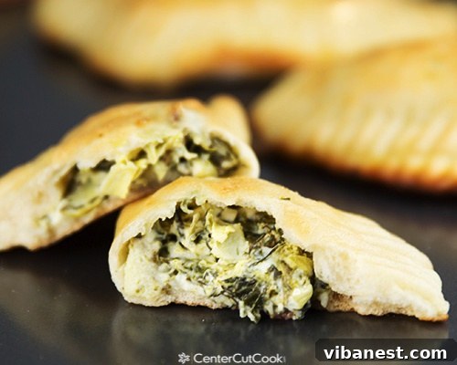 Ingredients for Creamy Artichoke Spinach Pockets laid out, with a bowl of the prepared creamy filling in the center