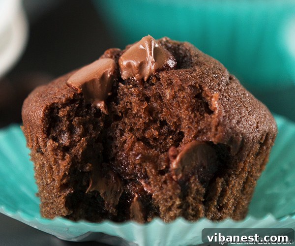 Chocoholic's Dream Muffins 5 Stack of rich chocolate chocolate chip muffins with melted chocolate oozing out