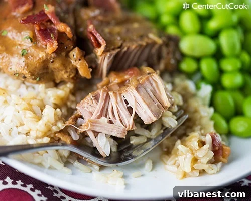 Delicious Crock Pot Pork Chops and Gravy Crock pot pork chops with rich gravy served over rice