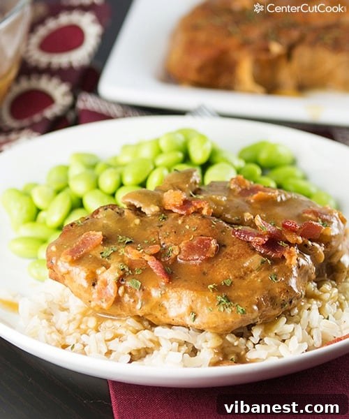 Hearty Slow Cooker Smothered Pork Chops Meal Slow cooker smothered pork chops with rice and a side of green vegetables