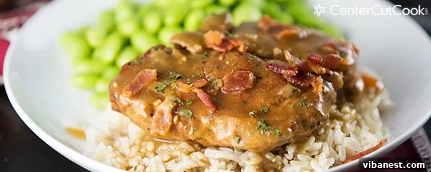 Slow Cooker Smothered Pork Chops - Ultimate Comfort Meal Close-up of slow cooker smothered pork chops with gravy