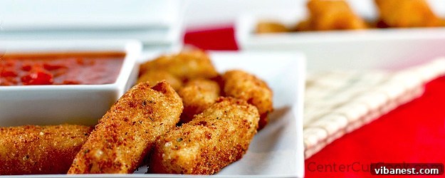 Delicious homemade mozzarella sticks Crispy mini mozzarella sticks served on a plate