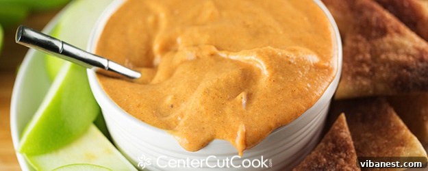 Delicious Pumpkin Pie Dip served with various dippers like apple slices and pie chips