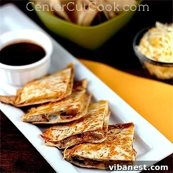 BBQ Ranch Chicken Quesadillas - Ready to Serve Closeup of a freshly made BBQ Ranch Chicken Quesadilla, cut into quarters