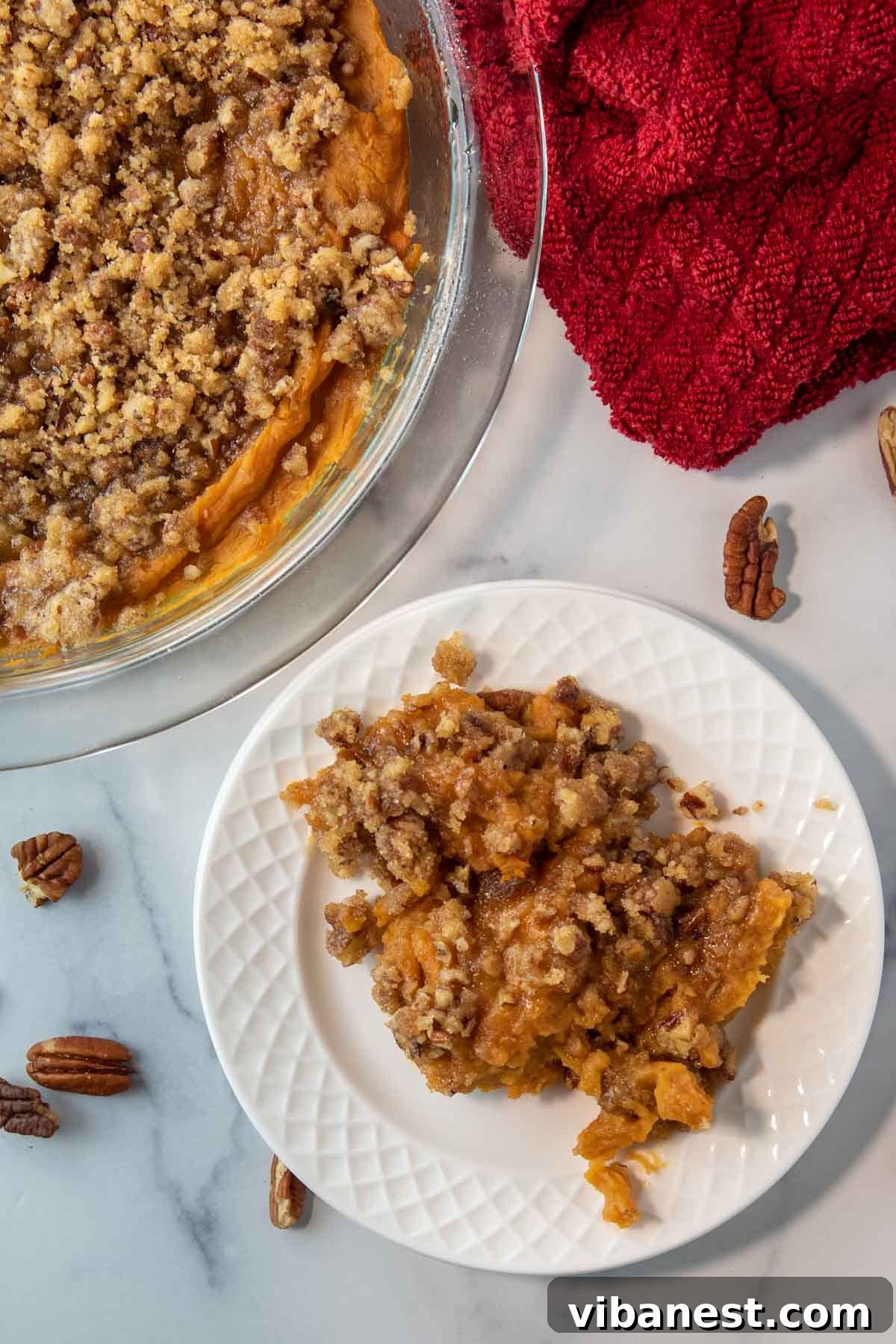 Ruth's Chris Style Sweet Potato Casserole 2 bowl of sweet potato casserole next to a plate of sweet potato casserole