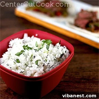 Cilantro Lime Rice Recipe Detail Closeup of freshly made Cilantro Lime Rice with a spoon, ready to serve