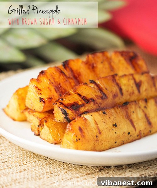 grilled pineapple 4.jpg Close-up of golden grilled pineapple spears on a platter
