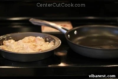 sschicken 2.jpg Chicken pieces browning in a hot skillet with vegetable oil.