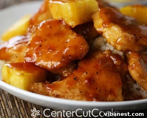 sweet and sour chicken 3.jpg Close-up of baked sweet and sour chicken with pineapple and peppers.